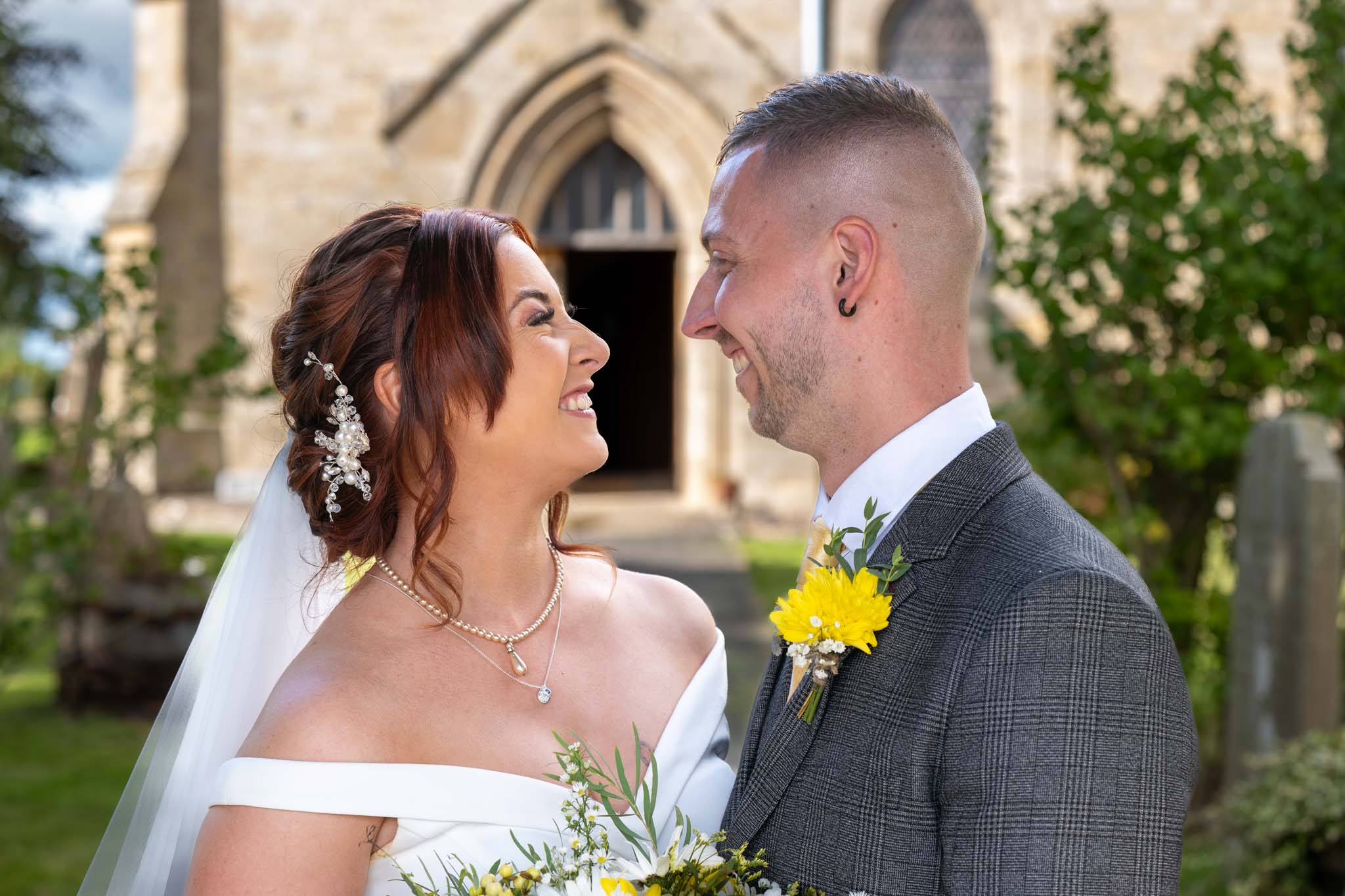 Married couple getting photographs at St. Mary's Church